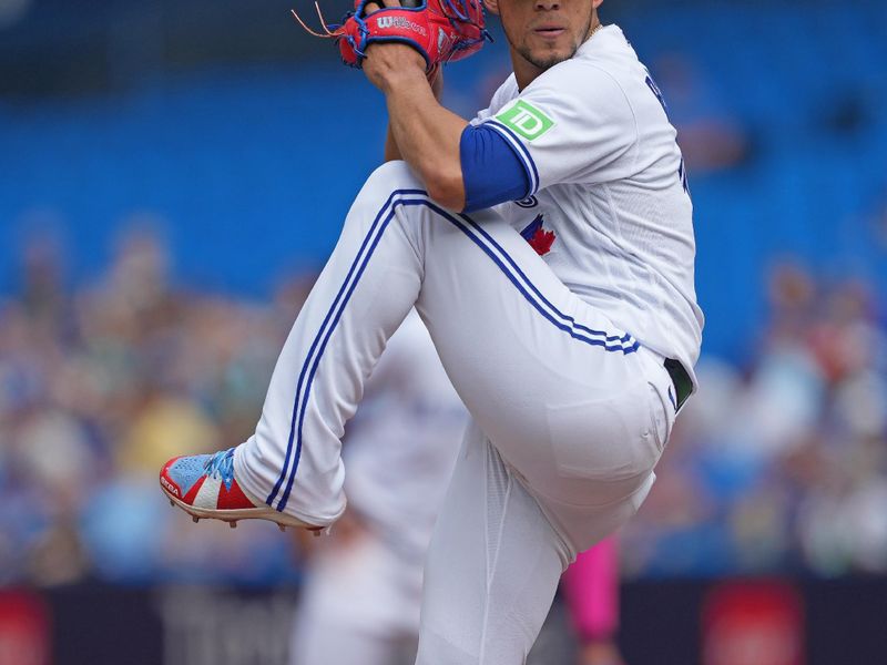 Sep 10, 2023; Toronto, Ontario, CAN; Toronto Blue Jays starting pitcher Jose Berrios (17) throws a pitch against the Kansas City Royals during the first inning at Rogers Centre. Mandatory Credit: Nick Turchiaro-USA TODAY Sports