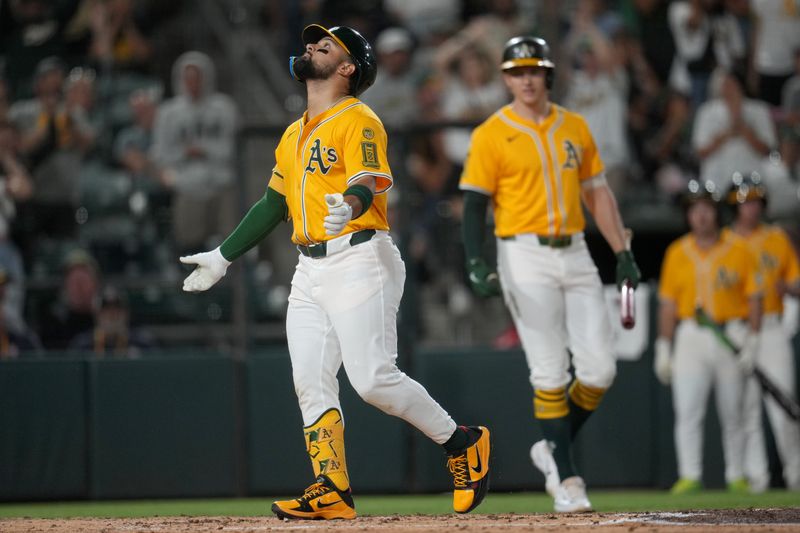 Sep 12, 2025; West Sacramento, California, USA; Athletics left fielder Carlos Cortes (26) reacts after hitting a home run against the Cincinnati Reds in the third inning at Sutter Health Park. Mandatory Credit: Cary Edmondson-Imagn Images