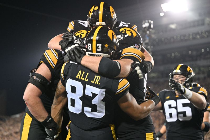 Sep 30, 2023; Iowa City, Iowa, USA; Iowa Hawkeyes tight end Erick All (83) reacts with offensive lineman Gennings Dunker (rear) and offensive lineman Rusty Feth (60) and offensive lineman Nick DeJong (56) on a touchdown pass against the Michigan State Spartans during the second quarter at Kinnick Stadium. Mandatory Credit: Jeffrey Becker-USA TODAY Sports