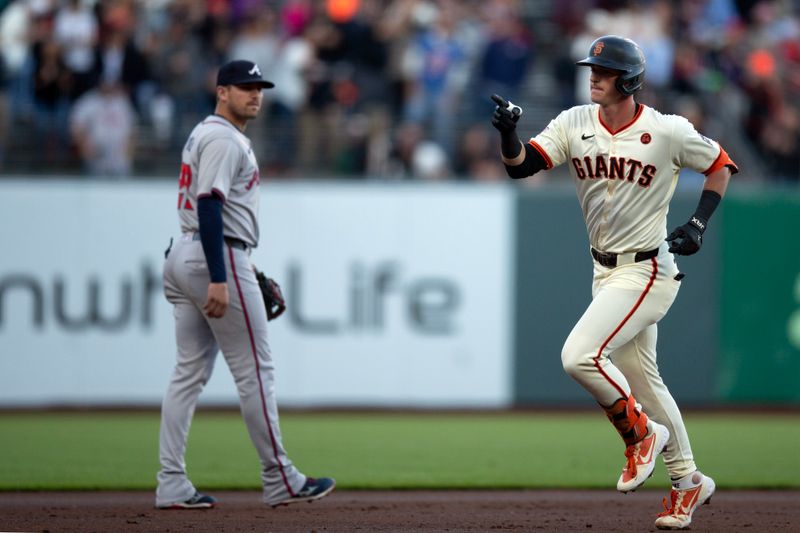 Aug 14, 2024; San Francisco, California, USA; San Francisco Giants shortstop Tyler Fitzgerald (right) runs out his solo home run against the Atlanta Braves during the first inning at Oracle Park. Mandatory Credit: D. Ross Cameron-USA TODAY Sports