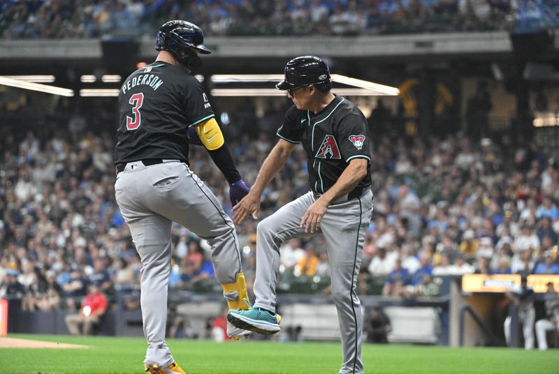 Sep 21, 2024; Milwaukee, Wisconsin, USA; Arizona Diamondbacks designated hitter Joc Pederson (3) is congratulated by Arizona Diamondbacks third base coach Tony Perezchica (21) after hitting a home run against the Milwaukee Brewers in the first inning at American Family Field. Mandatory Credit: Michael McLoone-Imagn Images