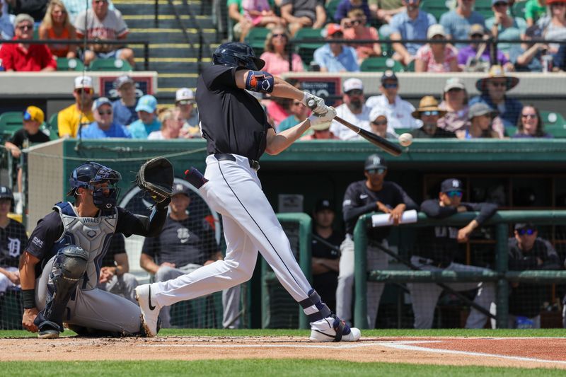 Mar 23, 2024; Lakeland, Florida, USA; Detroit Tigers center fielder Parker Meadows (22) hits a single during the first inning against the New York Yankees at Publix Field at Joker Marchant Stadium. Mandatory Credit: Mike Watters-USA TODAY Sports