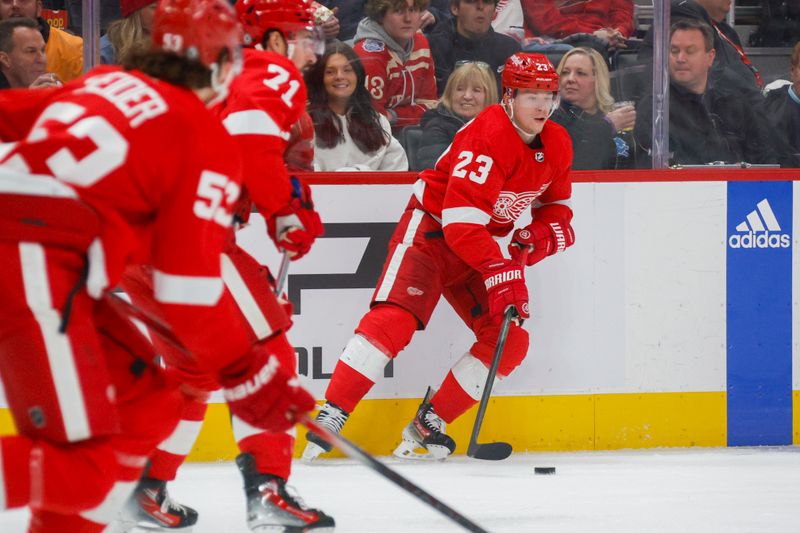 Jan 21, 2024; Detroit, Michigan, USA; Detroit Red Wings left wing Lucas Raymond (23) handles the puck during the first period at Little Caesars Arena. Mandatory Credit: Brian Bradshaw Sevald-USA TODAY Sports