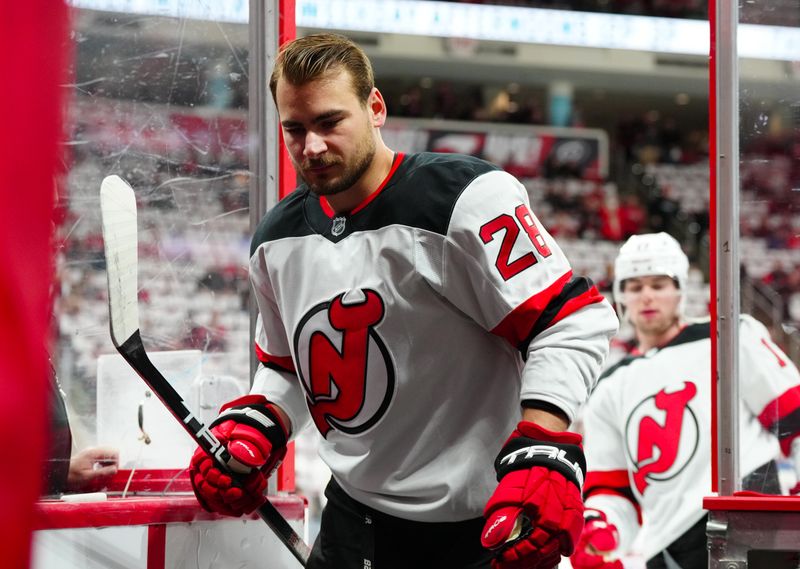 Apr 29, 2025; Raleigh, North Carolina, USA; New Jersey Devils right wing Timo Meier (28) comes off the ice after the warmups before the game against the Carolina Hurricanes in game five of the first round of the 2025 Stanley Cup Playoffs at Lenovo Center. Mandatory Credit: James Guillory-Imagn Images