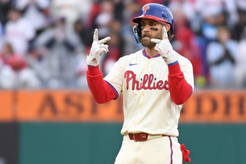 Apr 6, 2025; Philadelphia, Pennsylvania, USA; Philadelphia Phillies first base Bryce Harper (3) reacts after hitting a double during the seventh inning against the Los Angeles Dodgers at Citizens Bank Park. Mandatory Credit: Eric Hartline-Imagn Images