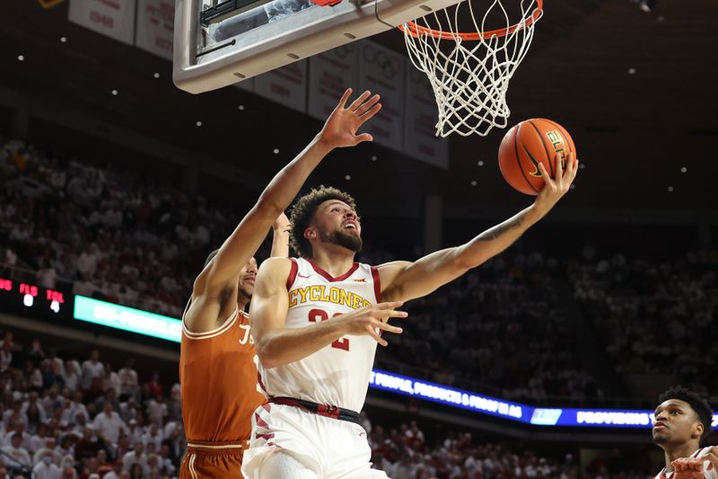 Jan 17, 2023; Ames, Iowa, USA; Iowa State Cyclones guard Gabe Kalscheur (22) scores against the Texas Longhorns in the first half at James H. Hilton Coliseum. Mandatory Credit: Reese Strickland-USA TODAY Sports