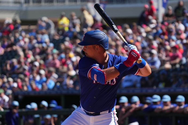 Mar 4, 2024; Surprise, Arizona, USA; Texas Rangers first baseman Nathaniel Lowe (30) bats against the Los Angeles Angels during the first inning at Surprise Stadium. Mandatory Credit: Joe Camporeale-USA TODAY Sports