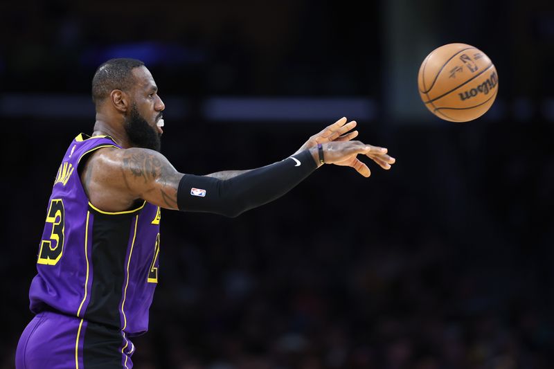 LOS ANGELES, CALIFORNIA - MARCH 22: LeBron James #23 of the Los Angeles Lakers passes the ball during the first half of a game against the Philadelphia 76ers at Crypto.com Arena on March 22, 2024 in Los Angeles, California. NOTE TO USER: User expressly acknowledges and agrees that, by downloading and/or using this photograph, user is consenting to the terms and conditions of the Getty Images License Agreement. (Photo by Sean M. Haffey/Getty Images)