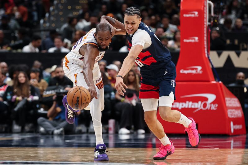 WASHINGTON, DC - JANUARY 16: Kevin Durant #35 of the Phoenix Suns and Kyshawn George #18 of the Washington Wizards vie for the ball during the second half at Capital One Arena on January 16, 2025 in Washington, DC. NOTE TO USER: User expressly acknowledges and agrees that, by downloading and or using this photograph, User is consenting to the terms and conditions of the Getty Images License Agreement. (Photo by Scott Taetsch/Getty Images)