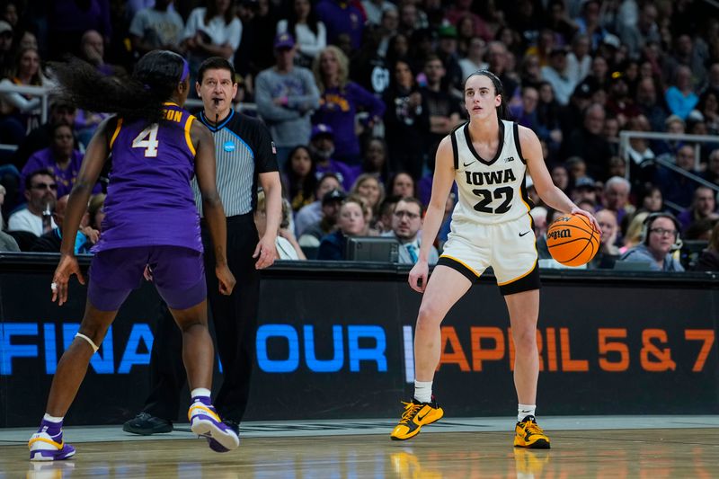 Apr 1, 2024; Albany, NY, USA; Iowa Hawkeyes guard Caitlin Clark (22) controls the ball against LSU Lady Tigers guard Flau'jae Johnson (4) in the fourth quarter in the finals of the Albany Regional in the 2024 NCAA Tournament at MVP Arena. Mandatory Credit: Gregory Fisher-USA TODAY Sports