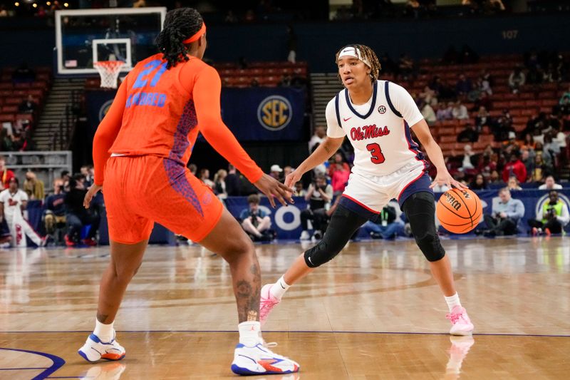 Mar 8, 2024; Greensville, SC, USA; Ole Miss Rebels guard Kennedy Todd-Williams (3) handles the ball against Florida Gators forward Eriny Kindred (21) during the first half at Bon Secours Wellness Arena. Mandatory Credit: Jim Dedmon-USA TODAY Sports