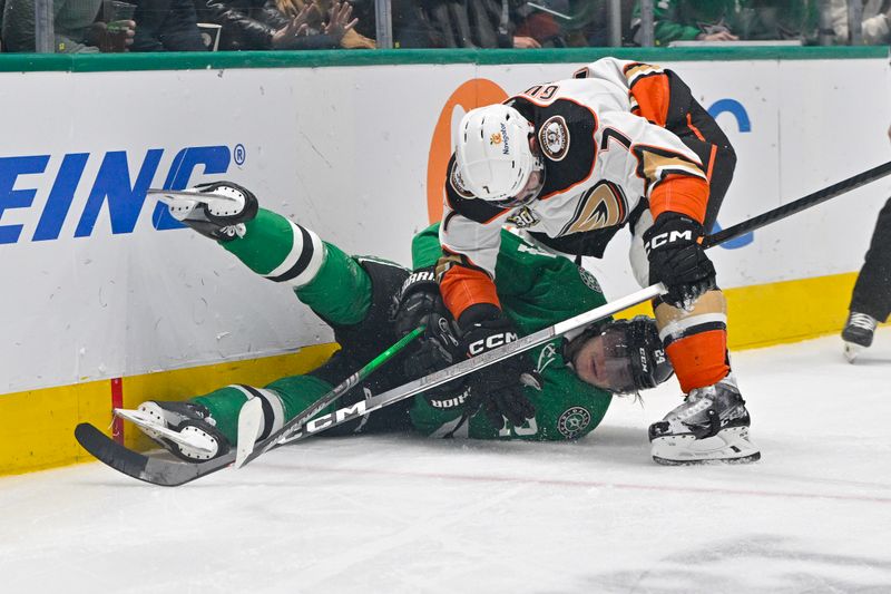 Jan 25, 2024; Dallas, Texas, USA; Anaheim Ducks defenseman Radko Gudas (7) takes down Dallas Stars center Roope Hintz (24) during the second period at the American Airlines Center. Mandatory Credit: Jerome Miron-USA TODAY Sports