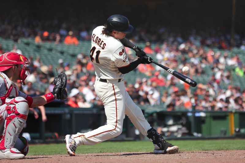 Aug 30, 2023; San Francisco, California, USA; San Francisco Giants first baseman Wilmer Flores (41) hits a single during the ninth inning against the Cincinnati Reds at Oracle Park. Mandatory Credit: Sergio Estrada-USA TODAY Sports