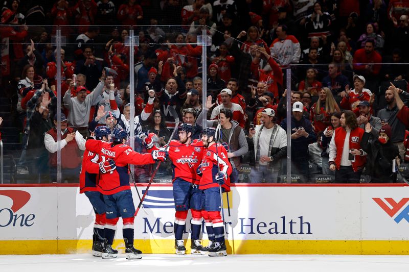 Feb 27, 2025; Washington, District of Columbia, USA; Washington Capitals left wing Pierre-Luc Dubois (80) celebrates with teammates after scoring a goal against the St. Louis Blues in the first period at Capital One Arena. Mandatory Credit: Geoff Burke-Imagn Images