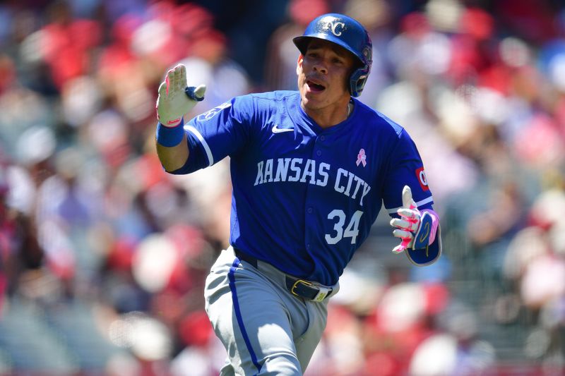 May 12, 2024; Anaheim, California, USA; Kansas City Royals catcher Freddy Fermin (34) reacts after hitting an RBI single against the Los Angeles Angels during the fourth inning at Angel Stadium. Mandatory Credit: Gary A. Vasquez-USA TODAY Sports