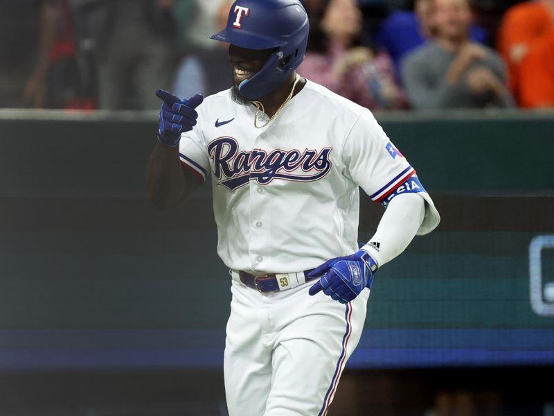 Oct 19, 2023; Arlington, Texas, USA; Texas Rangers right fielder Adolis Garcia (53) reacts after hitting a solo home run during the second inning in game four of the ALCS against the Houston Astros for the 2023 MLB playoffs at Globe Life Field. Mandatory Credit: Kevin Jairaj-USA TODAY Sports