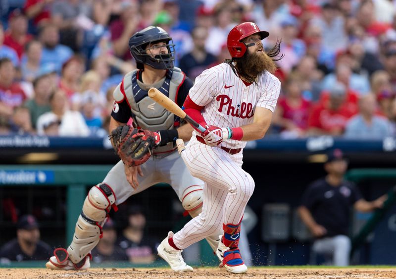 Jul 27, 2024; Philadelphia, Pennsylvania, USA;  Philadelphia Phillies outfielder Brandon Marsh (16) hits a two RBI home run in front of Cleveland Guardians catcher Austin Hedges (27) during the fourth inning at Citizens Bank Park. Mandatory Credit: Bill Streicher-USA TODAY Sports