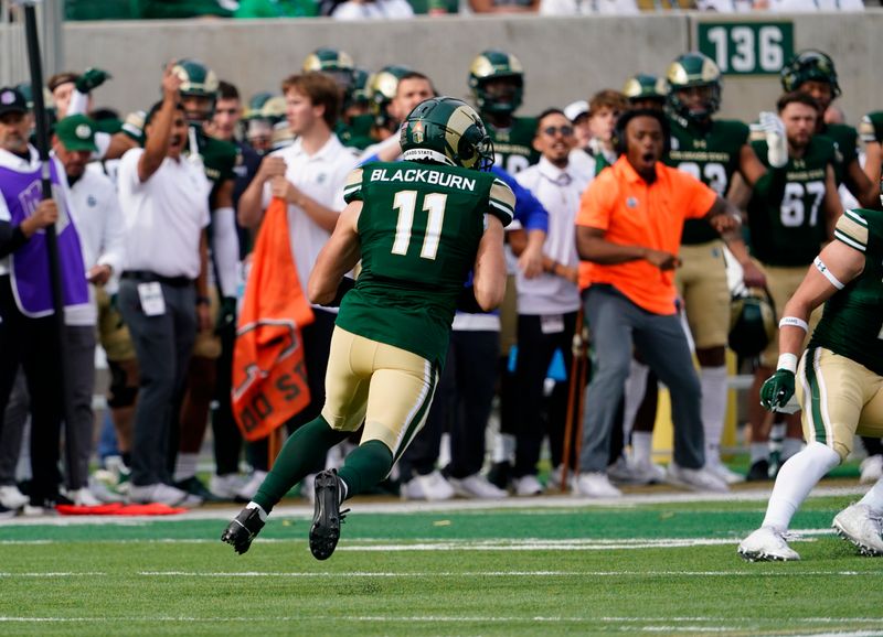 Nov 18, 2023; Fort Collins, Colorado, USA;  Colorado State Rams defensive back Henry Blackburn (11) heads upfield with an interception at Sonny Lubick Field at Canvas Stadium. Mandatory Credit: Michael Madrid-USA TODAY Sports