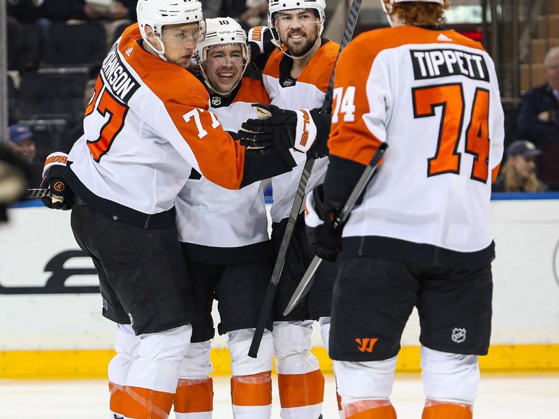 Apr 11, 2024; New York, New York, USA; Philadelphia Flyers right wing Bobby Brink (10) celebrates his goal against the New York Rangers with defenseman Erik Johnson (77), center Ryan Poehling (25) and right wing Owen Tippett (74) during the second period at Madison Square Garden. Mandatory Credit: Danny Wild-USA TODAY Sports