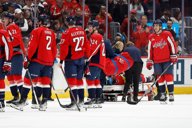 Apr 13, 2024; Washington, District of Columbia, USA; iIjured Washington Capitals defenseman Nick Jensen (3) is stretchered off the ice after a hit by Tampa Bay Lightning center Michael Eyssimont (not pictured) in the first period at Capital One Arena. Mandatory Credit: Geoff Burke-USA TODAY Sports