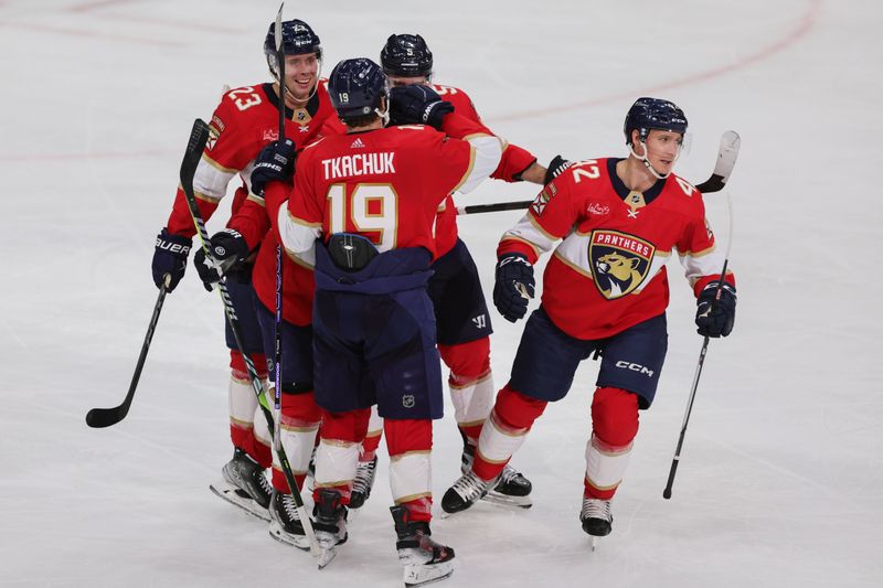 Jan 19, 2024; Sunrise, Florida, USA; Florida Panthers defenseman Gustav Forsling (42) celebrates with teammates after scoring against the Minnesota Wild during the third period at Amerant Bank Arena. Mandatory Credit: Sam Navarro-USA TODAY Sports