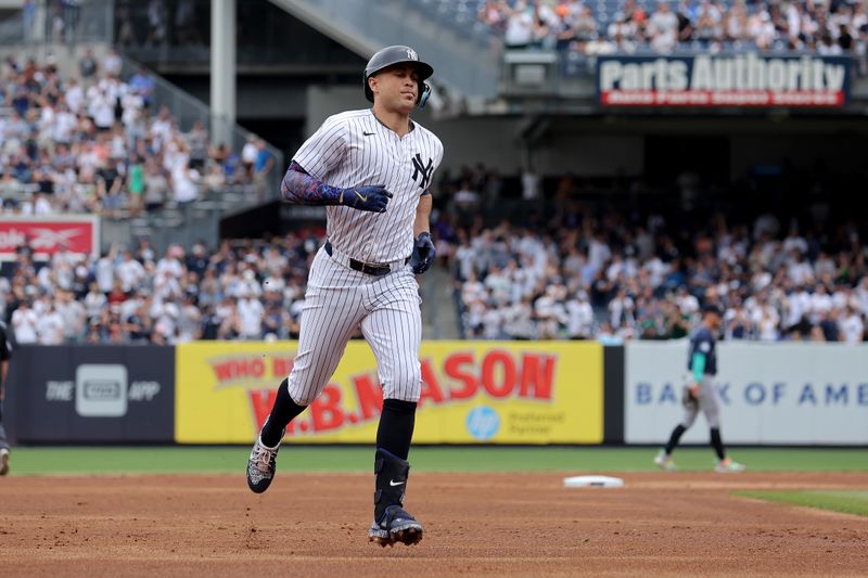 May 23, 2024; Bronx, New York, USA; New York Yankees designated hitter Giancarlo Stanton (27) rounds the bases after hitting a solo home run against the Seattle Mariners during the second inning at Yankee Stadium. Mandatory Credit: Brad Penner-USA TODAY Sports