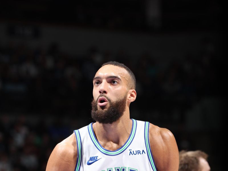 MINNEAPOLIS, MN -  JANUARY 18: Rudy Gobert #27 of the Minnesota Timberwolves prepares to shoot a free throw during the game against the Memphis Grizzlies on January 18, 2024 at Target Center in Minneapolis, Minnesota. NOTE TO USER: User expressly acknowledges and agrees that, by downloading and or using this Photograph, user is consenting to the terms and conditions of the Getty Images License Agreement. Mandatory Copyright Notice: Copyright 2024 NBAE (Photo by David Sherman/NBAE via Getty Images)