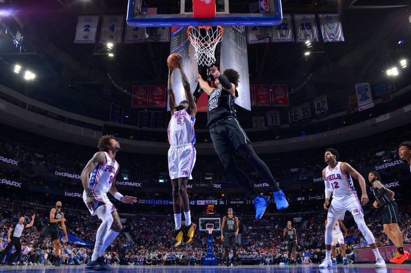 PHILADELPHIA, PA - APRIL 14: Mo Bamba #5 of the Philadelphia 76ers rebounds the ball during the game against the Brooklyn Nets on April 14, 2024 at the Wells Fargo Center in Philadelphia, Pennsylvania NOTE TO USER: User expressly acknowledges and agrees that, by downloading and/or using this Photograph, user is consenting to the terms and conditions of the Getty Images License Agreement. Mandatory Copyright Notice: Copyright 2024 NBAE (Photo by Jesse D. Garrabrant/NBAE via Getty Images)