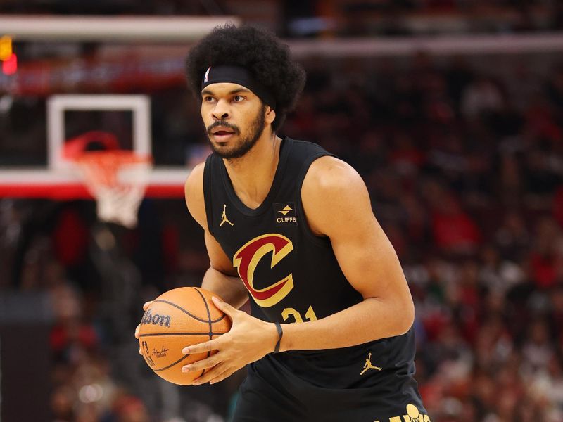 CHICAGO, ILLINOIS - DECEMBER 23: Jarrett Allen #31 of the Cleveland Cavaliers dribbles against the Chicago Bulls during the first half at the United Center on December 23, 2023 in Chicago, Illinois. NOTE TO USER: User expressly acknowledges and agrees that, by downloading and or using this photograph, User is consenting to the terms and conditions of the Getty Images License Agreement.  (Photo by Michael Reaves/Getty Images)