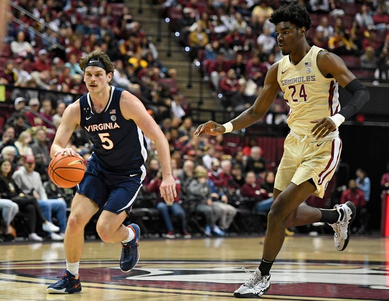 Jan 14, 2023; Tallahassee, Florida, USA; Virginia Cavaliers forward Ben Vander Plas (5) drives to the net past Florida State Seminoles forward Naheem Mcleod (24) during the first half at Donald L. Tucker Center. Mandatory Credit: Melina Myers-USA TODAY Sports