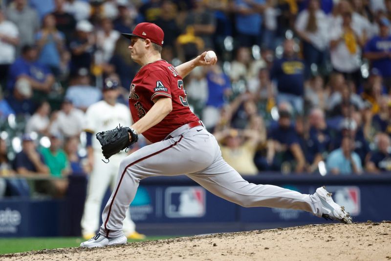 Oct 4, 2023; Milwaukee, Wisconsin, USA; Arizona Diamondbacks relief pitcher Paul Sewald (38) pitches against the Milwaukee Brewers in the ninth inning during game two of the Wildcard series for the 2023 MLB playoffs at American Family Field. Mandatory Credit: Kamil Krzaczynski-USA TODAY Sports