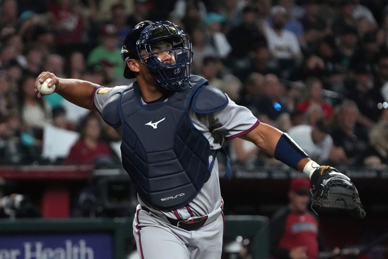 Apr 27, 2025; Phoenix, Arizona, USA; Atlanta Braves catcher Drake Baldwin (30) makes the throw for an out against the Arizona Diamondbacks in the first inning at Chase Field. Mandatory Credit: Rick Scuteri-Imagn Images