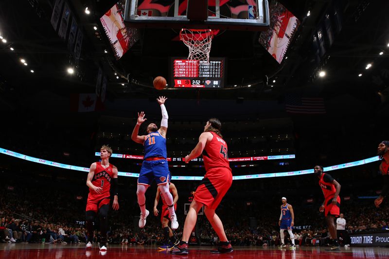 TORONTO, CANADA - MARCH 27: Jalen Brunson #11 of the New York Knicks shoots the ball during the game against the Toronto Raptors on March 27, 2024 at the Scotiabank Arena in Toronto, Ontario, Canada.  NOTE TO USER: User expressly acknowledges and agrees that, by downloading and or using this Photograph, user is consenting to the terms and conditions of the Getty Images License Agreement.  Mandatory Copyright Notice: Copyright 2024 NBAE (Photo by Vaughn Ridley/NBAE via Getty Images)