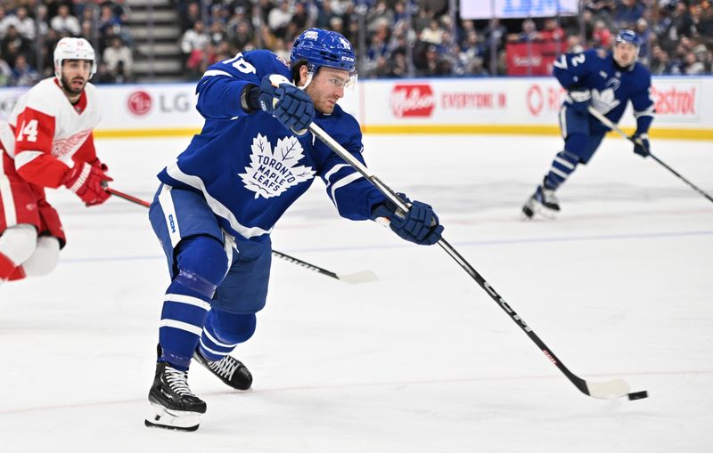 Jan 14, 2024; Toronto, Ontario, CAN;  Toronto Maple Leafs forward Noah Gregor (18) shoots the puck against the Detroit Red Wings in the third period at Scotiabank Arena. Mandatory Credit: Dan Hamilton-USA TODAY Sports