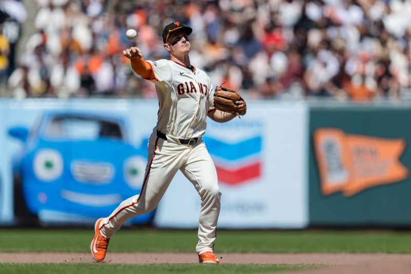 Apr 21, 2024; San Francisco, California, USA;  San Francisco Giants third baseman Matt Chapman (26) throws to first base for an out against the Arizona Diamondbacks during the seventh inning at Oracle Park. Mandatory Credit: John Hefti-USA TODAY Sports