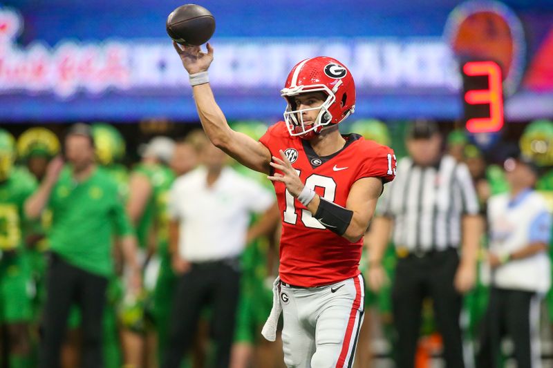 Sep 3, 2022; Atlanta, Georgia, USA; Georgia Bulldogs quarterback Stetson Bennett (13) throws a pass against the Oregon Ducks in the first quarter at Mercedes-Benz Stadium. Mandatory Credit: Brett Davis-USA TODAY Sports
