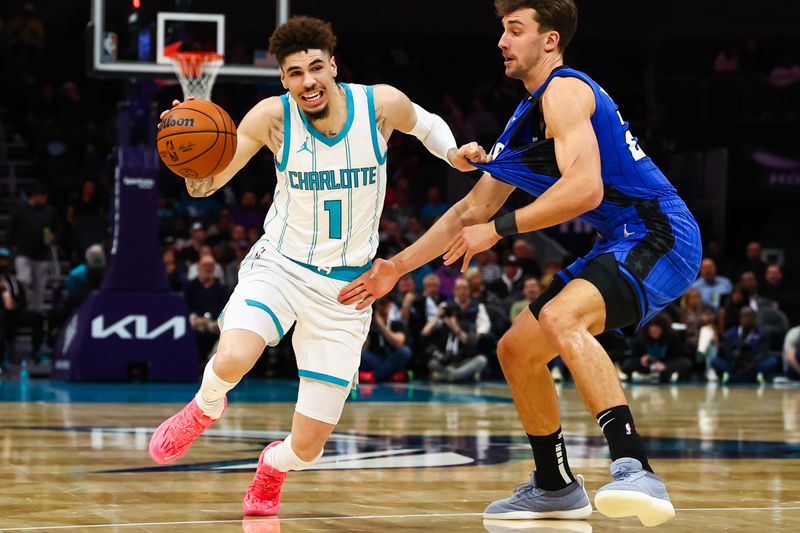 CHARLOTTE, NORTH CAROLINA - NOVEMBER 25: LaMelo Ball #1 of the Charlotte Hornets drives to the basket during the first half of a basketball game against the Orlando Magic at Spectrum Center on November 25, 2024 in Charlotte, North Carolina. NOTE TO USER: User expressly acknowledges and agrees that, by downloading and or using this photograph, User is consenting to the terms and conditions of the Getty Images License Agreement. (Photo by David Jensen/Getty Images)