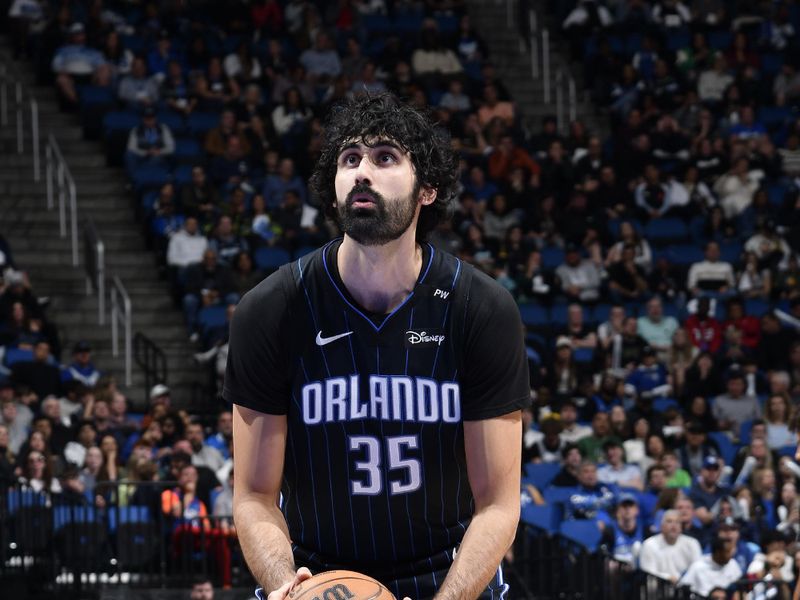 ORLANDO, FL - JANUARY 5 :  Goga Bitadze #35 of the Orlando Magic shoots a free throw during the game against the Utah Jazz on January 5, 2025 at Kia Center in Orlando, Florida. NOTE TO USER: User expressly acknowledges and agrees that, by downloading and or using this photograph, User is consenting to the terms and conditions of the Getty Images License Agreement. Mandatory Copyright Notice: Copyright 2025 NBAE (Photo by Fernando Medina/NBAE via Getty Images)