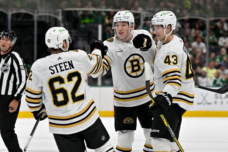 Nov 6, 2023; Dallas, Texas, USA; Boston Bruins defenseman Ian Mitchell (14) and defenseman Mason Lohrei (6) and left wing Danton Heinen (43) and center Oskar Steen (62) celebrates a goal scored by Lohrei against the Dallas Stars during the first period at the American Airlines Center. Mandatory Credit: Jerome Miron-USA TODAY Sports