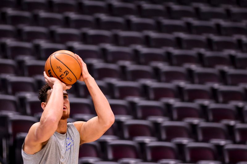 DENVER, COLORADO - NOVEMBER 10: Dwight Powell #7 of the Dallas Mavericks warms up before the game against the Denver Nuggets at Ball Arena on November 10, 2024 in Denver, Colorado. NOTE TO USER: User expressly acknowledges and agrees that, by downloading and/or using this Photograph, user is consenting to the terms and conditions of the Getty Images License Agreement. (Photo by Tyler Schank/Clarkson Creative/Getty Images)