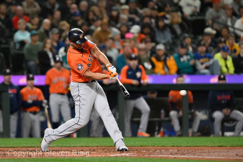 Sep 27, 2023; Seattle, Washington, USA; Houston Astros first baseman Jose Abreu (79) hits a single against the Seattle Mariners during the fourth inning at T-Mobile Park. Mandatory Credit: Steven Bisig-USA TODAY Sports