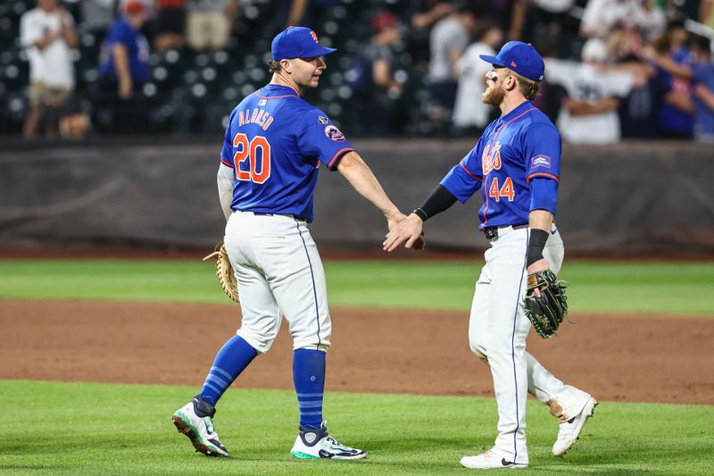 Jun 26, 2024; New York City, New York, USA;  New York Mets first baseman Pete Alonso (20) and New York Mets center fielder Harrison Bader (44) celebrate after defeating the New York Yankees 12-2 at Citi Field. Mandatory Credit: Wendell Cruz-USA TODAY Sports