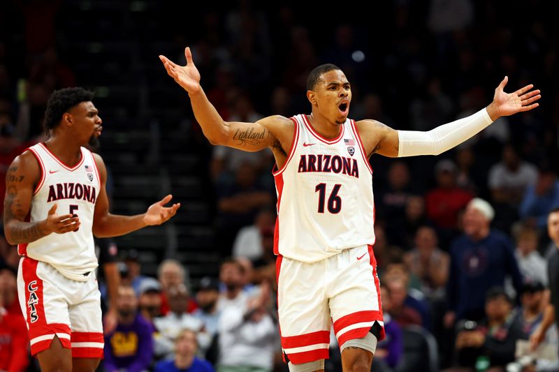 Dec 20, 2023; Phoenix, Arizona, USA; Arizona Wildcats forward Keshad Johnson (16) reacts to a call during the second half of the game against the Alabama Crimson Tide in the Hall of Fame Series at Footprint Center. Mandatory Credit: Mark J. Rebilas-USA TODAY Sports