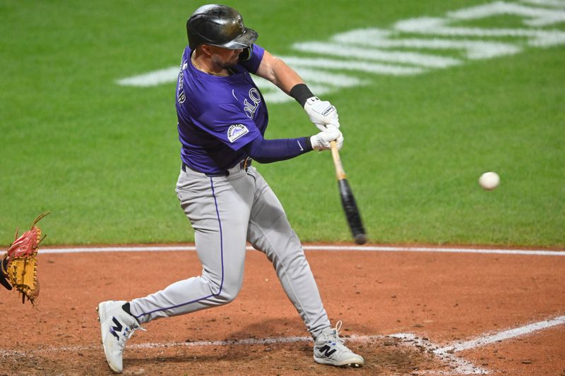 Jul 29, 2025; Cleveland, Ohio, USA; Colorado Rockies second baseman Kyle Farmer (6) hits a solo home run in the ninth inning against the Cleveland Guardians at Progressive Field. Mandatory Credit: David Richard-Imagn Images