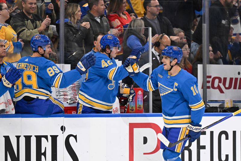 Nov 4, 2023; St. Louis, Missouri, USA; St. Louis Blues center Brayden Schenn (10) is congratulated by teammates after scoring a goal against the Montreal Canadiens during the third period at Enterprise Center. Mandatory Credit: Jeff Le-USA TODAY Sports