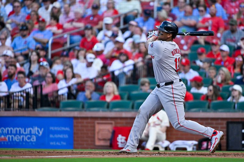 May 18, 2024; St. Louis, Missouri, USA;  Boston Red Sox third baseman Rafael Devers (11) hits a solo home run against the St. Louis Cardinals during the fourth inning at Busch Stadium. Mandatory Credit: Jeff Curry-USA TODAY Sports