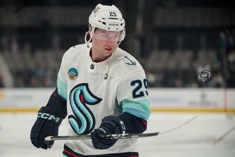 Jan 30, 2024; San Jose, California, USA; Seattle Kraken defenseman Vince Dunn (29) juggles the puck with his stick before the game between the San Jose Sharks and the Seattle Kraken at SAP Center at San Jose. Mandatory Credit: Robert Edwards-USA TODAY Sports