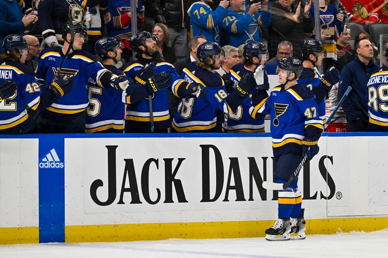 Apr 10, 2024; St. Louis, Missouri, USA;  St. Louis Blues defenseman Torey Krug (47) is congratulated by teammates after scoring against the Chicago Blackhawks during the first period at Enterprise Center. Mandatory Credit: Jeff Curry-USA TODAY Sports