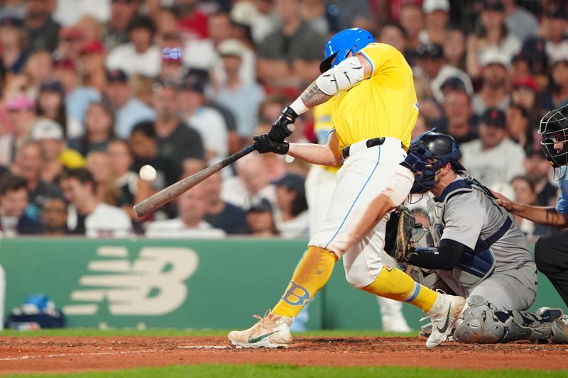 Jul 27, 2024; Boston, Massachusetts, USA; Boston Red Sox left fielder Tyler O'Neill (17) hits a home run against the New York Yankees during the fifth inning at Fenway Park. Mandatory Credit: Gregory Fisher-USA TODAY Sports