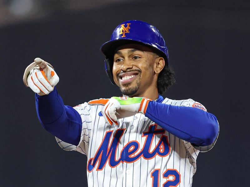 May 27, 2025; New York City, New York, USA; New York Mets shortstop Francisco Lindor (12) reacts after hitting a double during the sixth inning against the Chicago White Sox at Citi Field. Mandatory Credit: Vincent Carchietta-Imagn Images